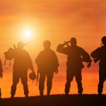 Silhouette,Of,A,Solider,Saluting,Against,The,Sunrise.,Concept,-